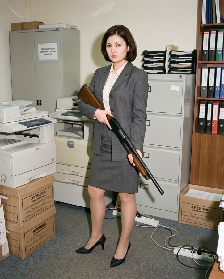 Olga, holding a shotgun